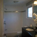 FRESH SUBWAY TILE WALLS AND GRANITE VANITY